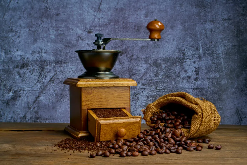 vintage coffee grinder with coffee beans